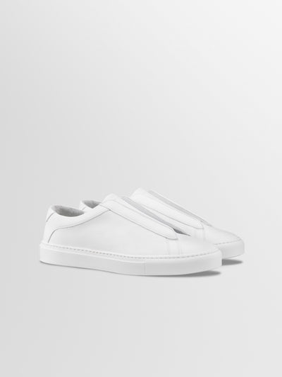 Men's white Italian leather slip on dress sneaker with white rubber sole.