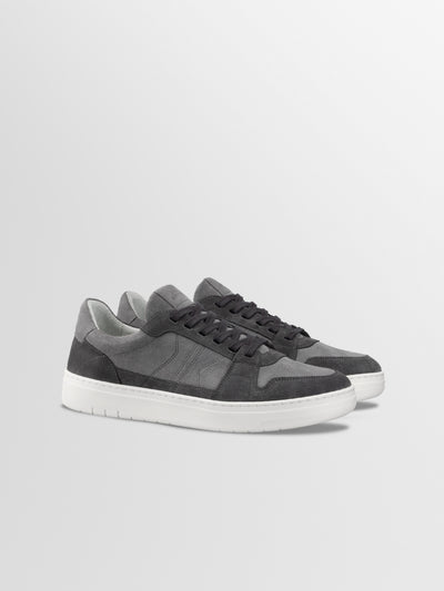 Men's tonal grey European leather lace-up sneaker with white rubber soles.