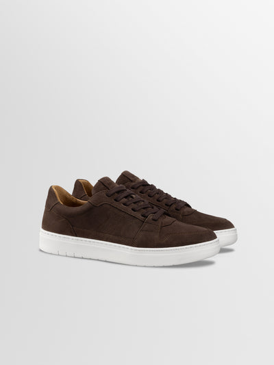 Men's dark brown European suede leather lace-up sneaker with white rubber soles.