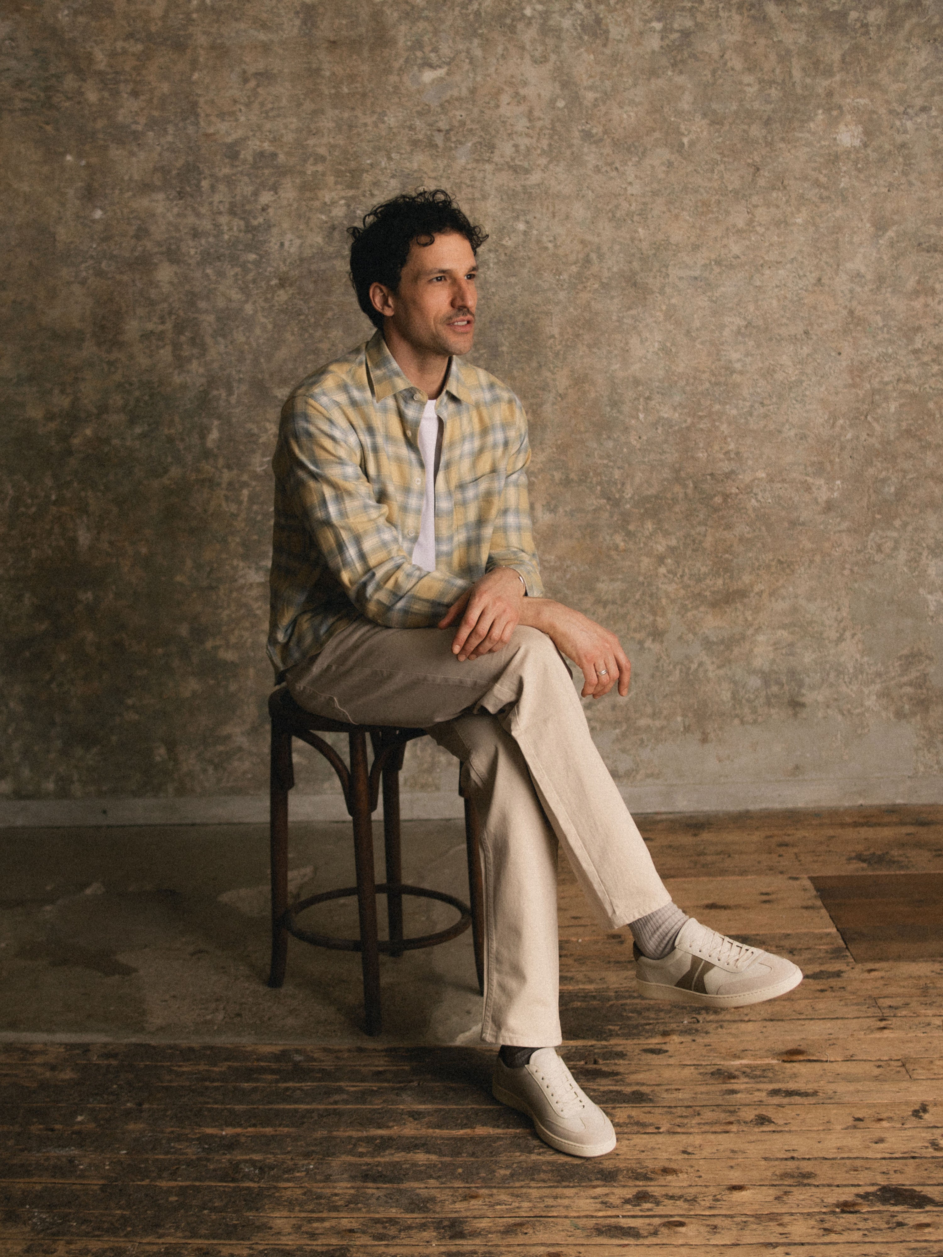 Man sitting wearing Men