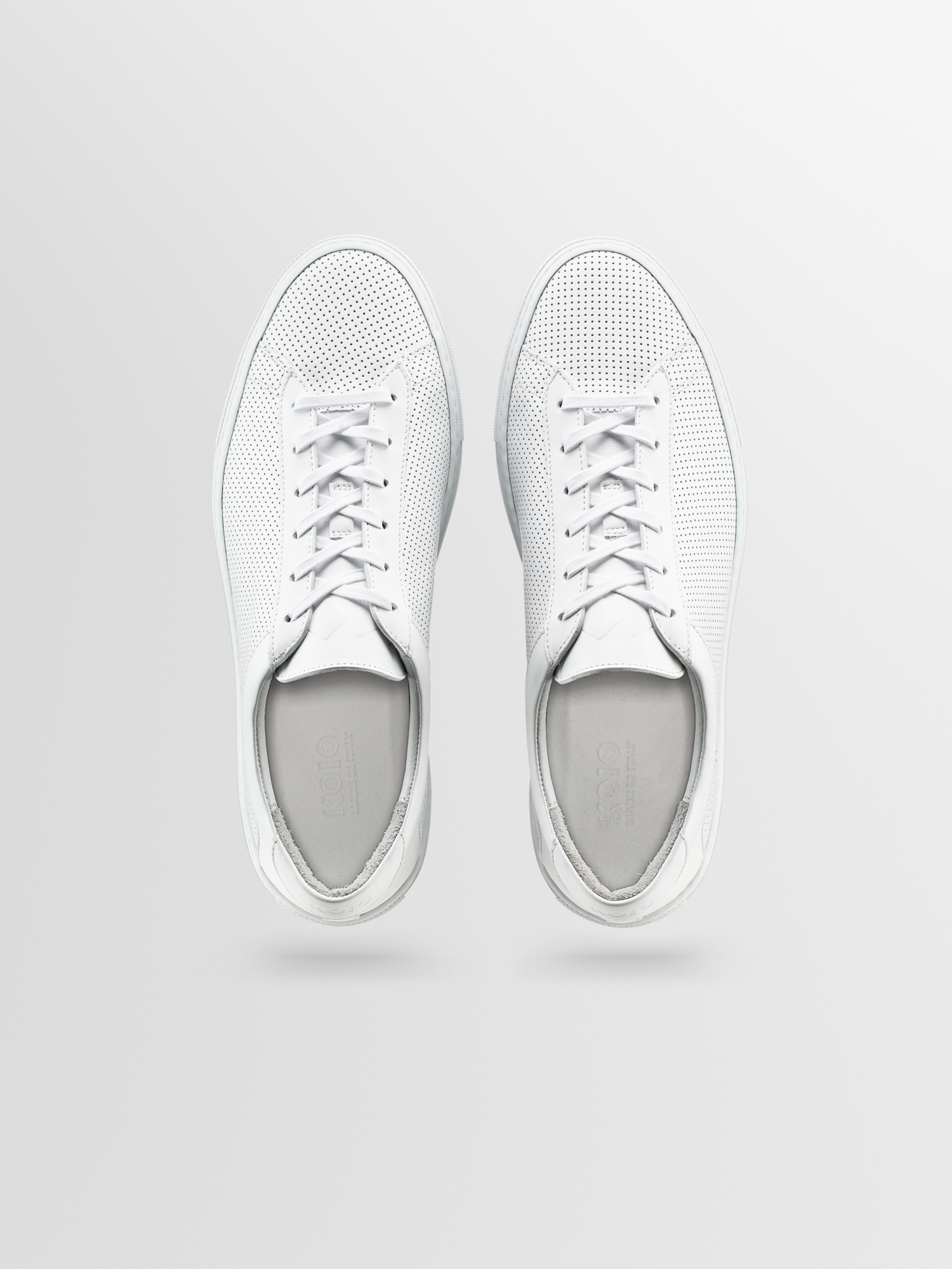 Perforated white sneakers discount
